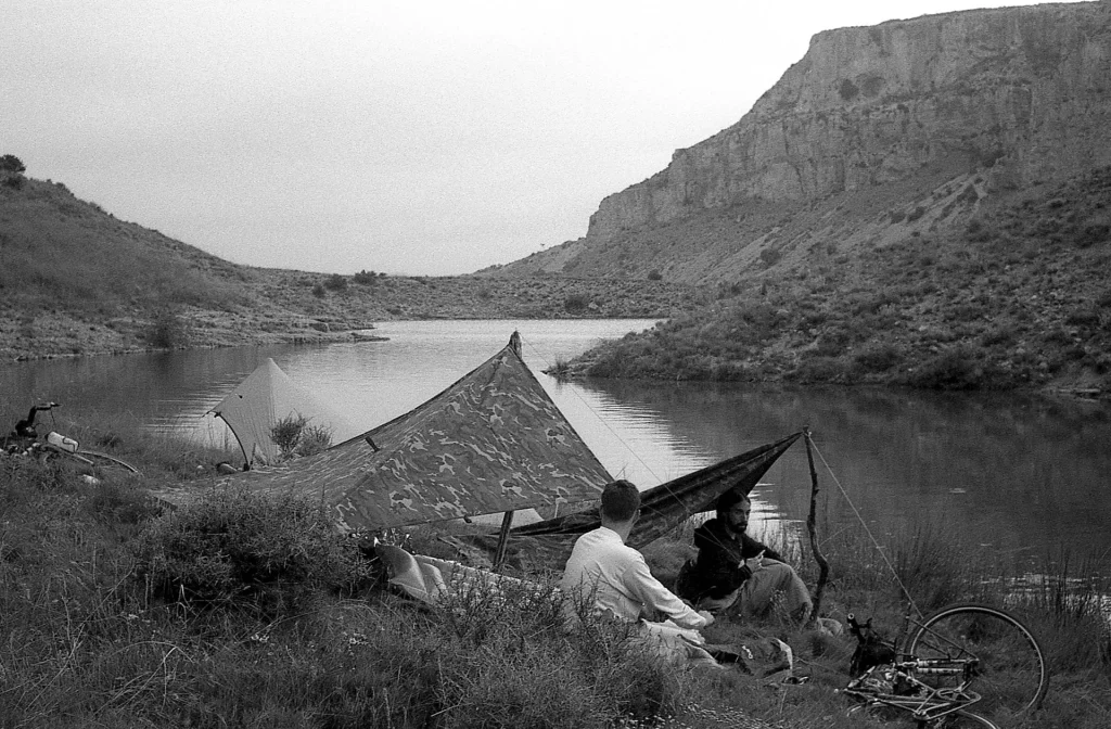 Jonathan and Suly chilling after setting the tarps by the shore of the reservoir
