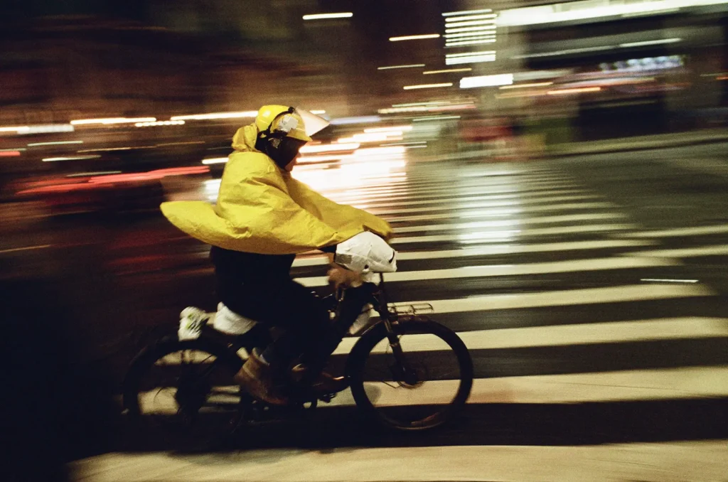 Electric bicycle speeding away in the rain