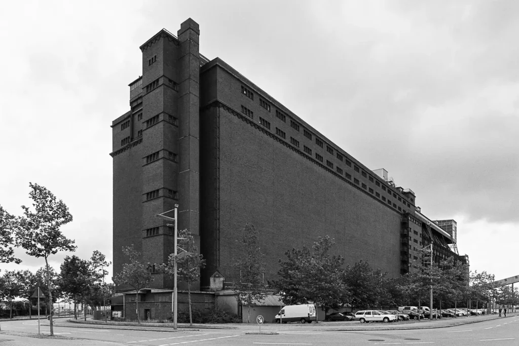 Large grain storage and loading facility ("der Koloss") at Bremen ports shot on Fuji Acros black-and-white film.