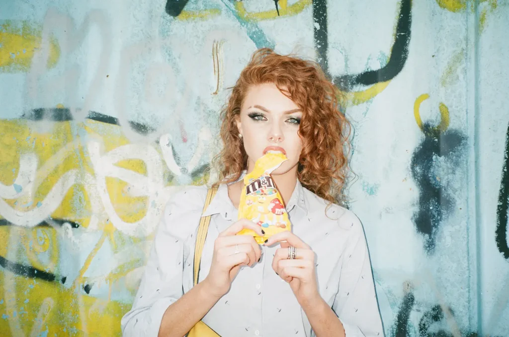 Canon Sureshot Zoom XL portrait of woman with M&Ms