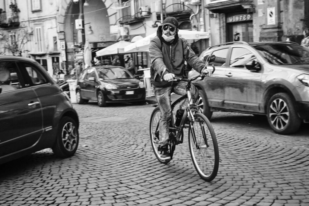 A man bicycling by.