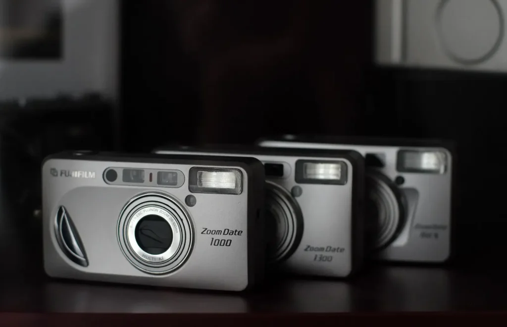 Three Fujifilm Zoom Date cameras