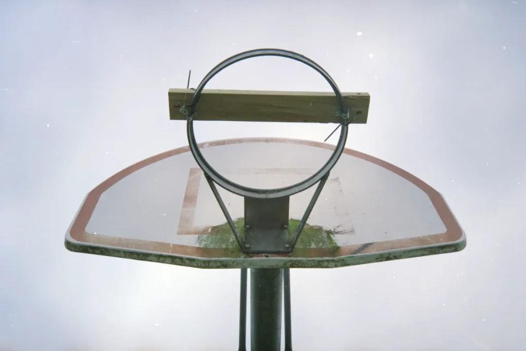Basketball hoop with piece of wood