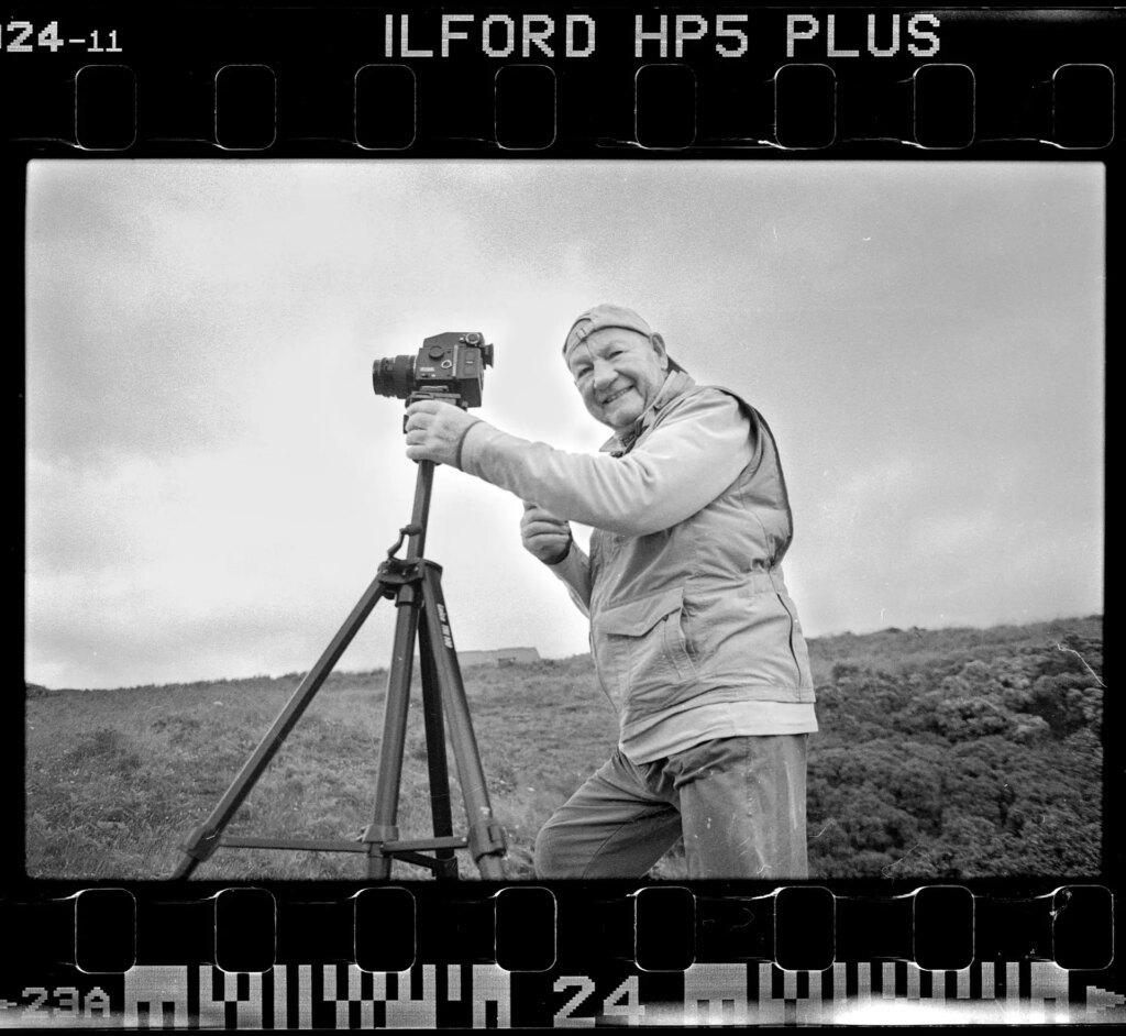 Simon Riddell Father taking pictures with a film camera