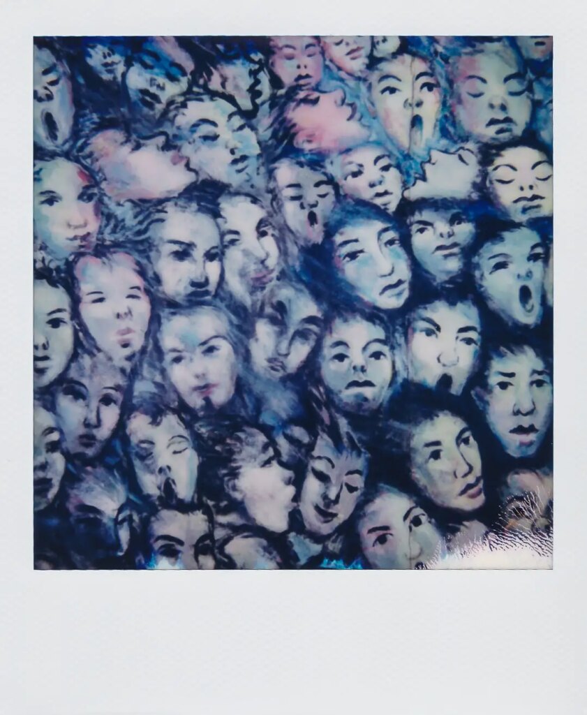 A polaroid depicting faces the night the Berlin Wall fell