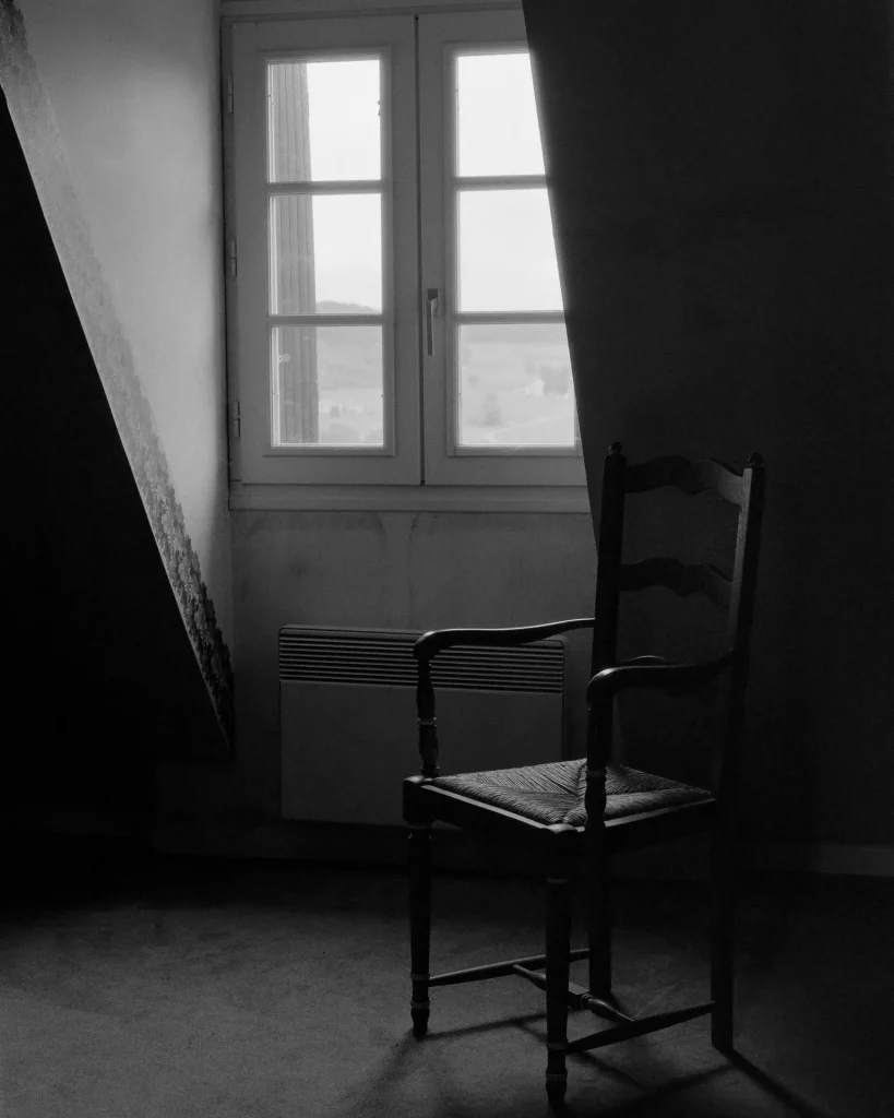 Picture of a window and empty chair