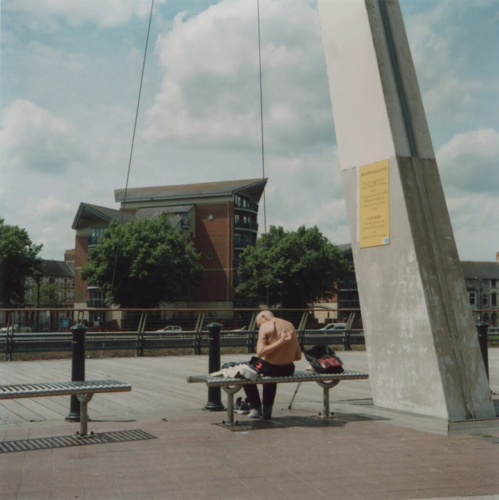 person sitting on bench - project image by ed worthington