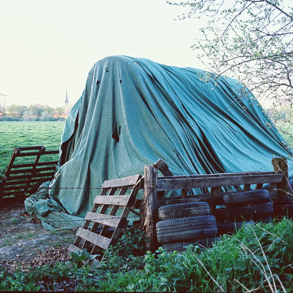 Covered straw bales taken with a Hasselblad medium format camera on 6x6 negative.