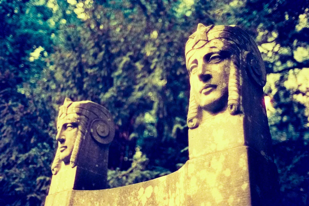 tombstone at the Engesohde cemetery in Hannover, shot on CineStill 800t film with an orange filter