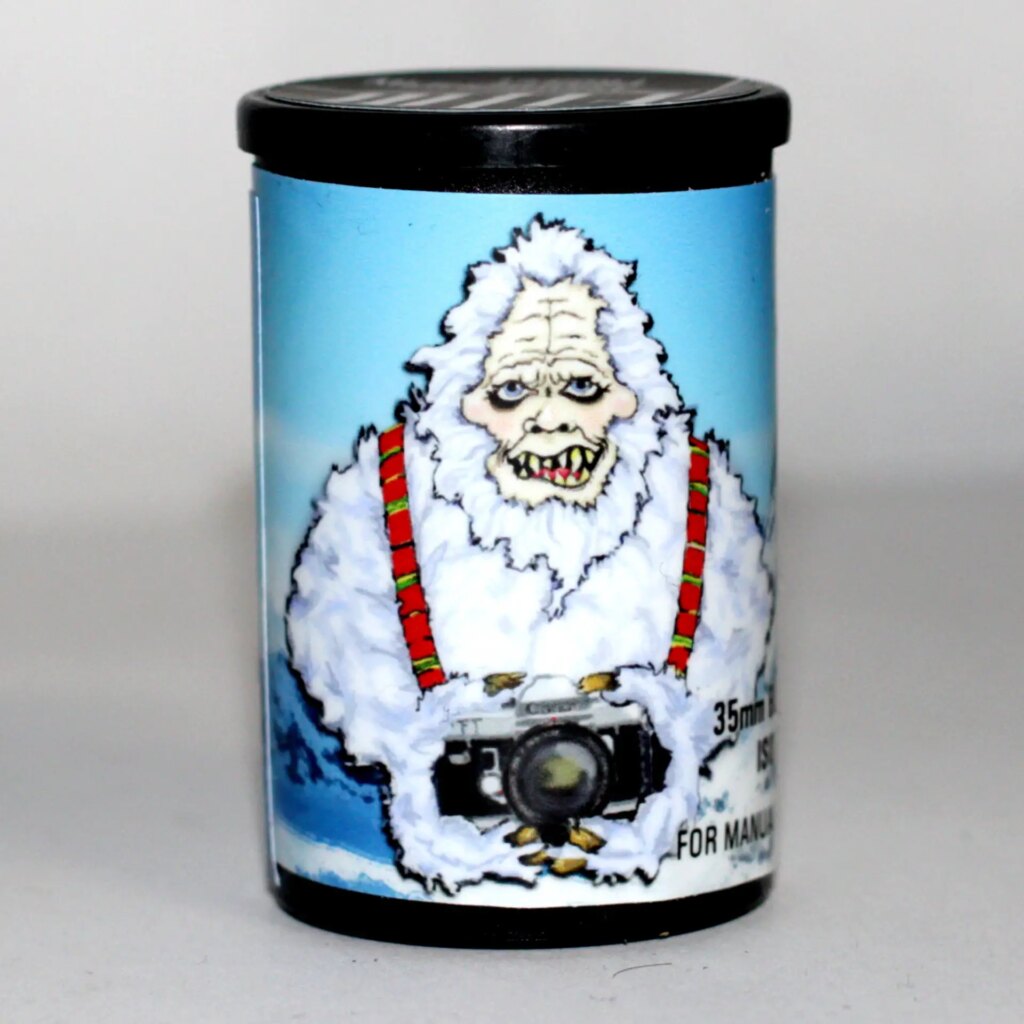 Yeti film cannister showing Yeti design holding camera