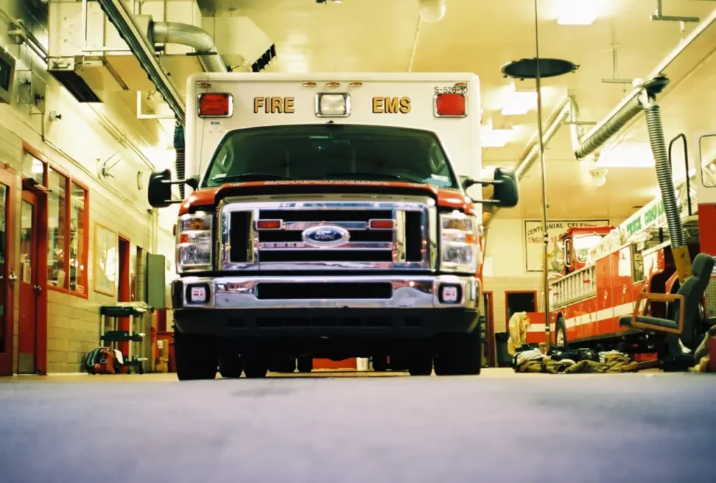 Image of ab American Ford fire truck in its garage.