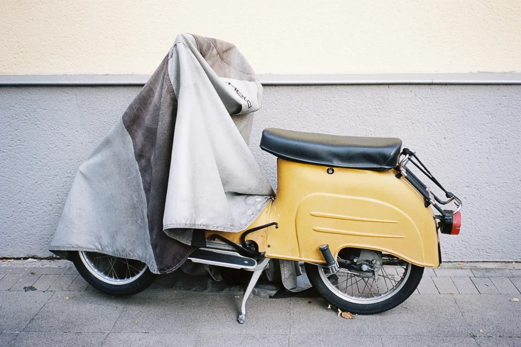 old scooter captured with a Konica Genba Kantoku on Kodak Portra film