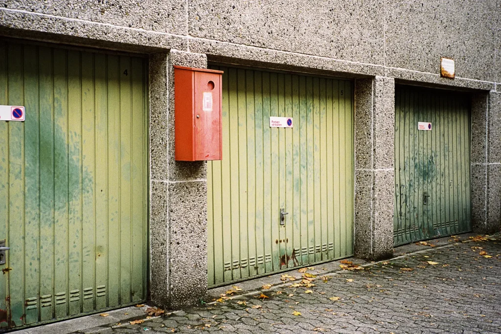 garage doors in a faded green color