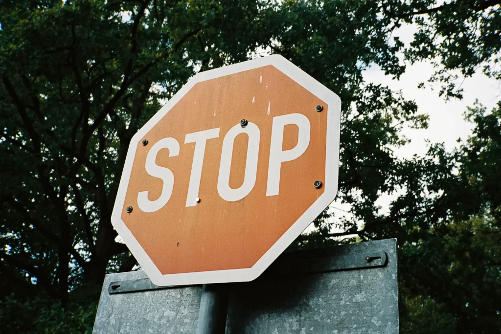 STOP sign captured with a Konica Genba Kantoku on Kodak Portra film