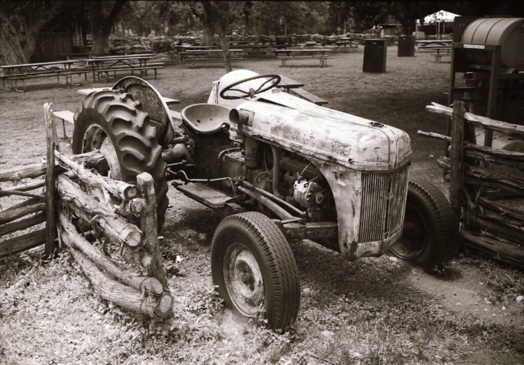 A black and white image of a tractor - Komura 35mm f/2.8 colour test shot