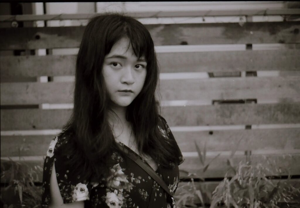 A black and white portrait of a woman - Komura 35mm f/2.8 colour test shot
