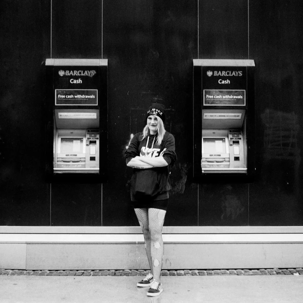 Woman in The Middle of ATMs