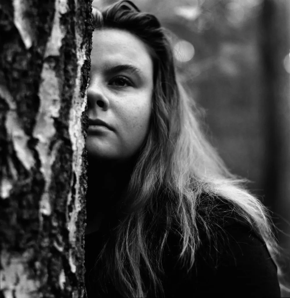 Woman Half Hidden by A tree