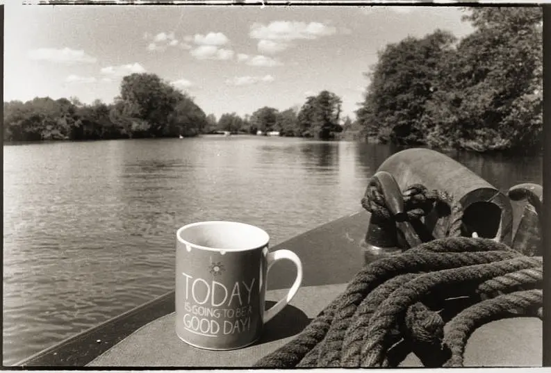 Test image of a mug on a boat in front of a river
