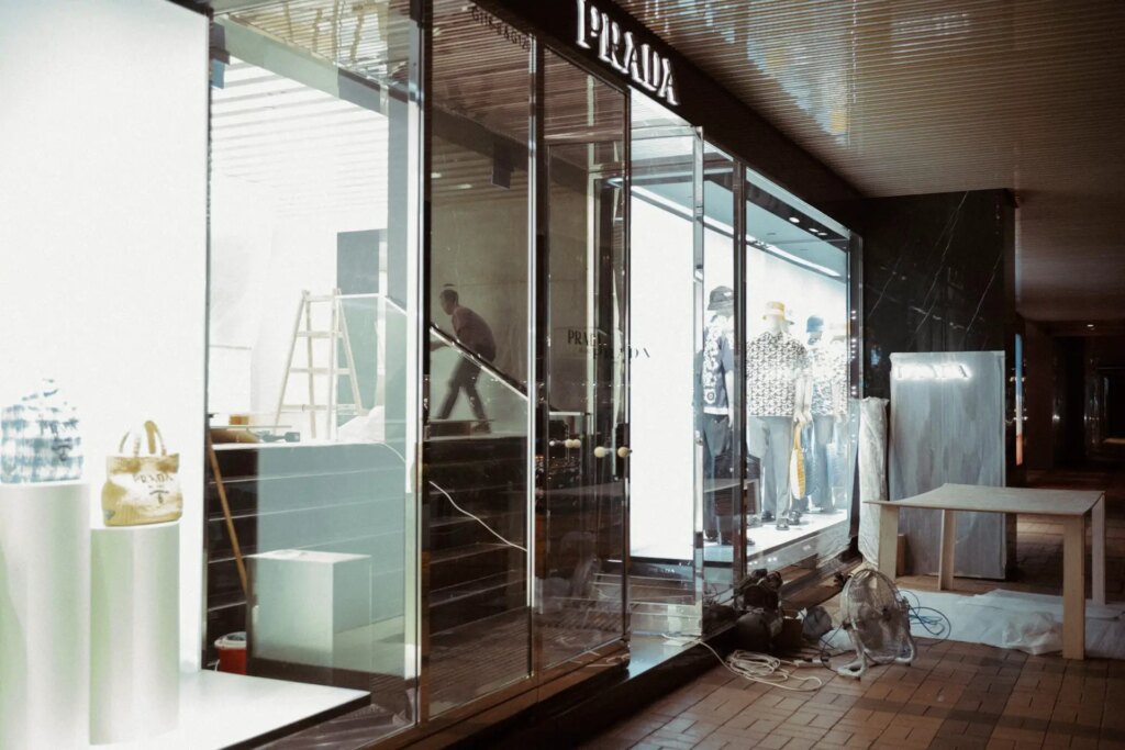 A worker decorating the Prada shop at midnight 