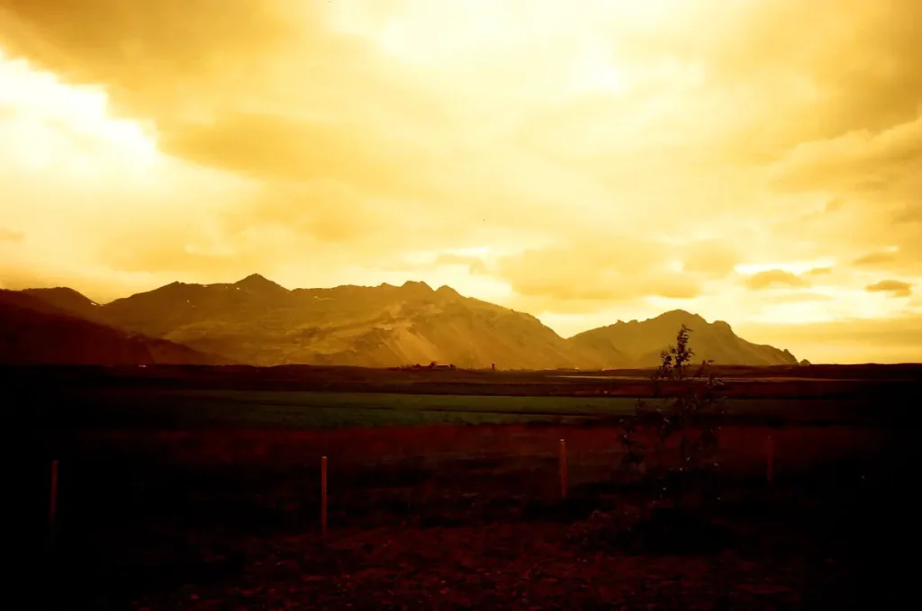 Icelandic flatlands leading to volcanoes. Five frames with a Canon AT-1 and a roll of Redscale.