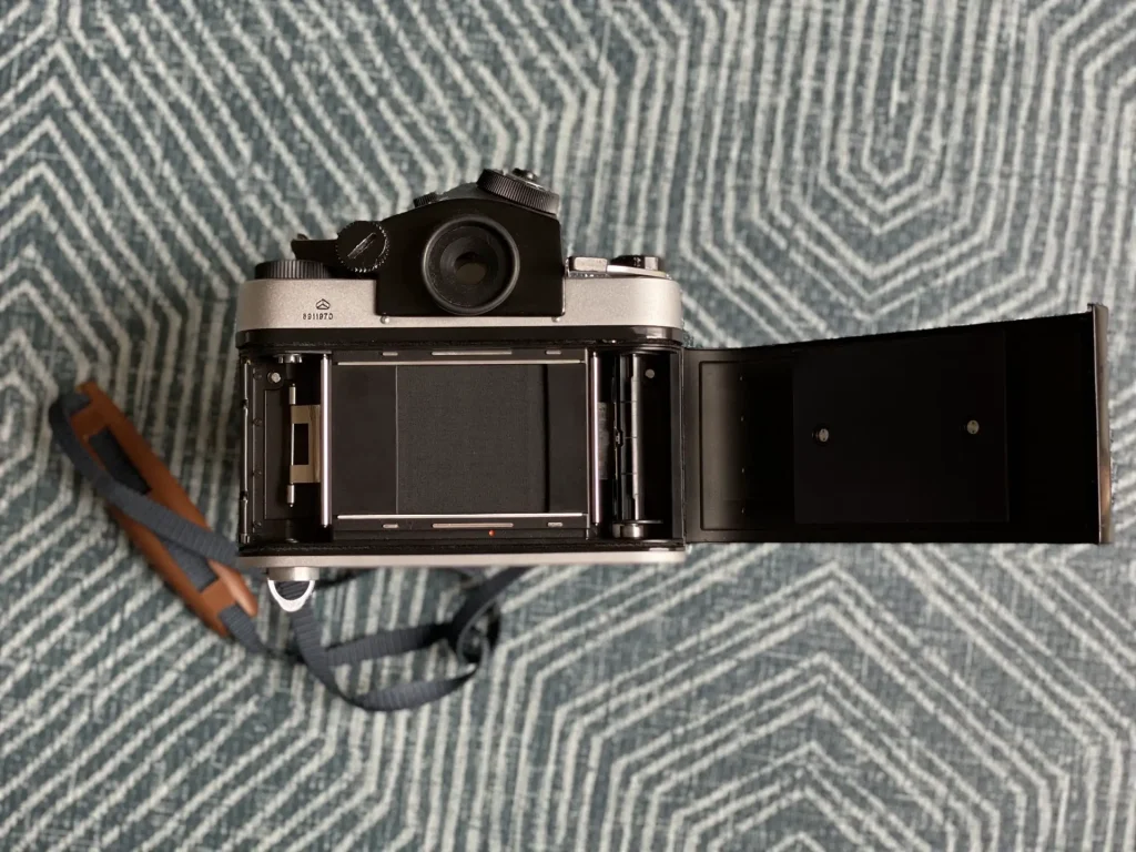 Kiev 60 SLR rear view with film loading door open showing focal plane shutter and spools.