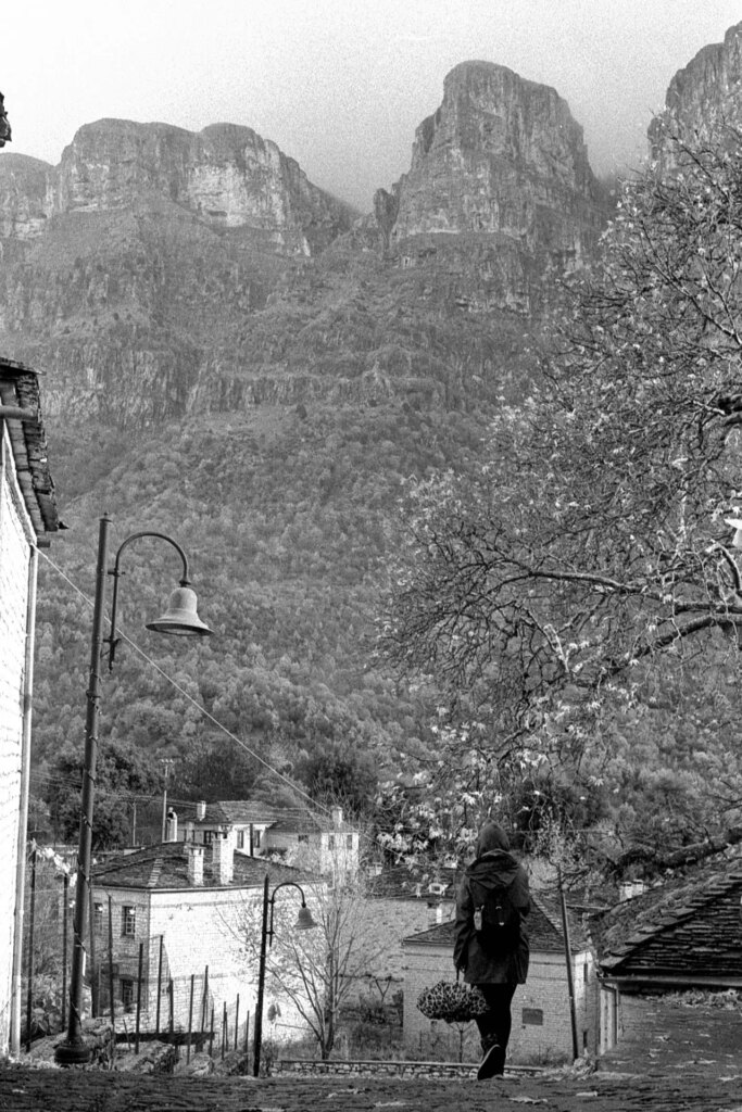 Girl walking by mountain 
