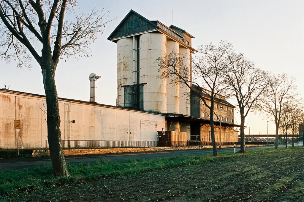 Color image of the abandoned grain elevator shining in the last rays of the sun.