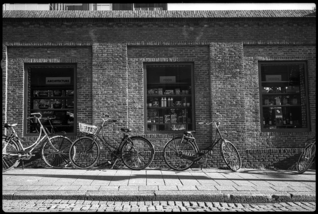 Bicycles parked in front of an old brick building, Rotterdam