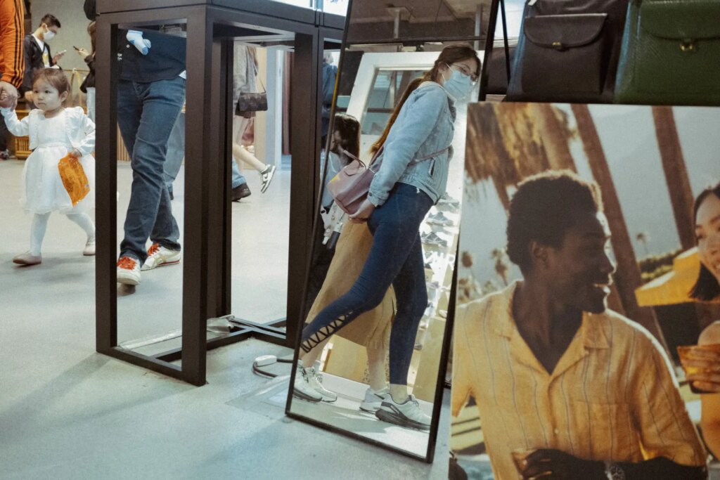 Reflections from the full length mirror inside a shopping mall