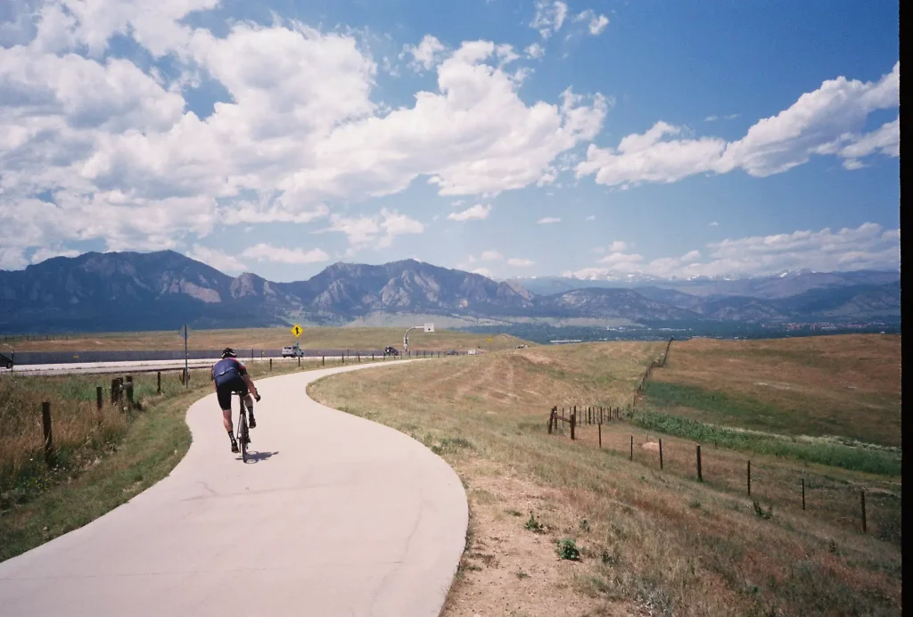 Cyclist looking over the Flatirons