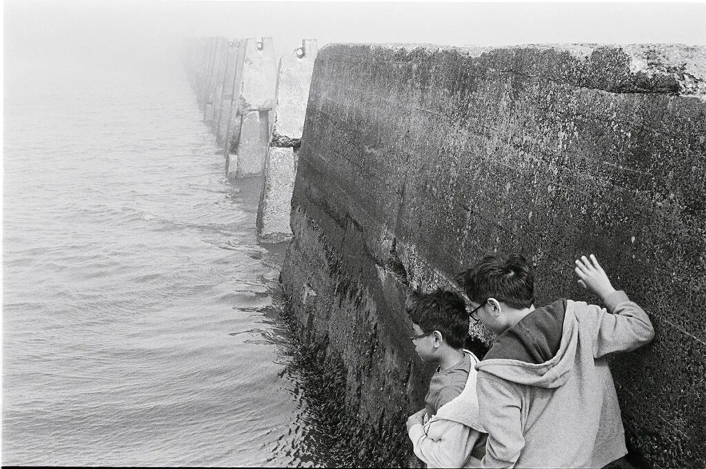 Boys exploring off the Cramond Causeway, Scotland. August 2021