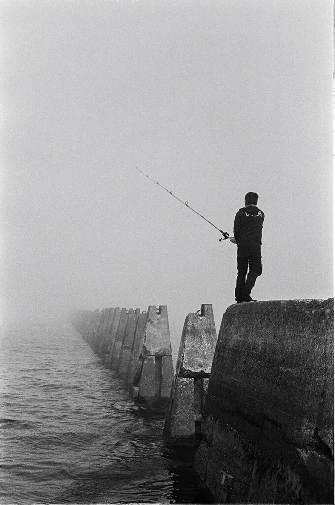 Fishing off the Cramond Causeway, Scotland. August 2021