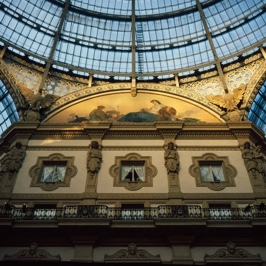 Sunset light cast on a Galeria Vittorio Emanuele II wall.