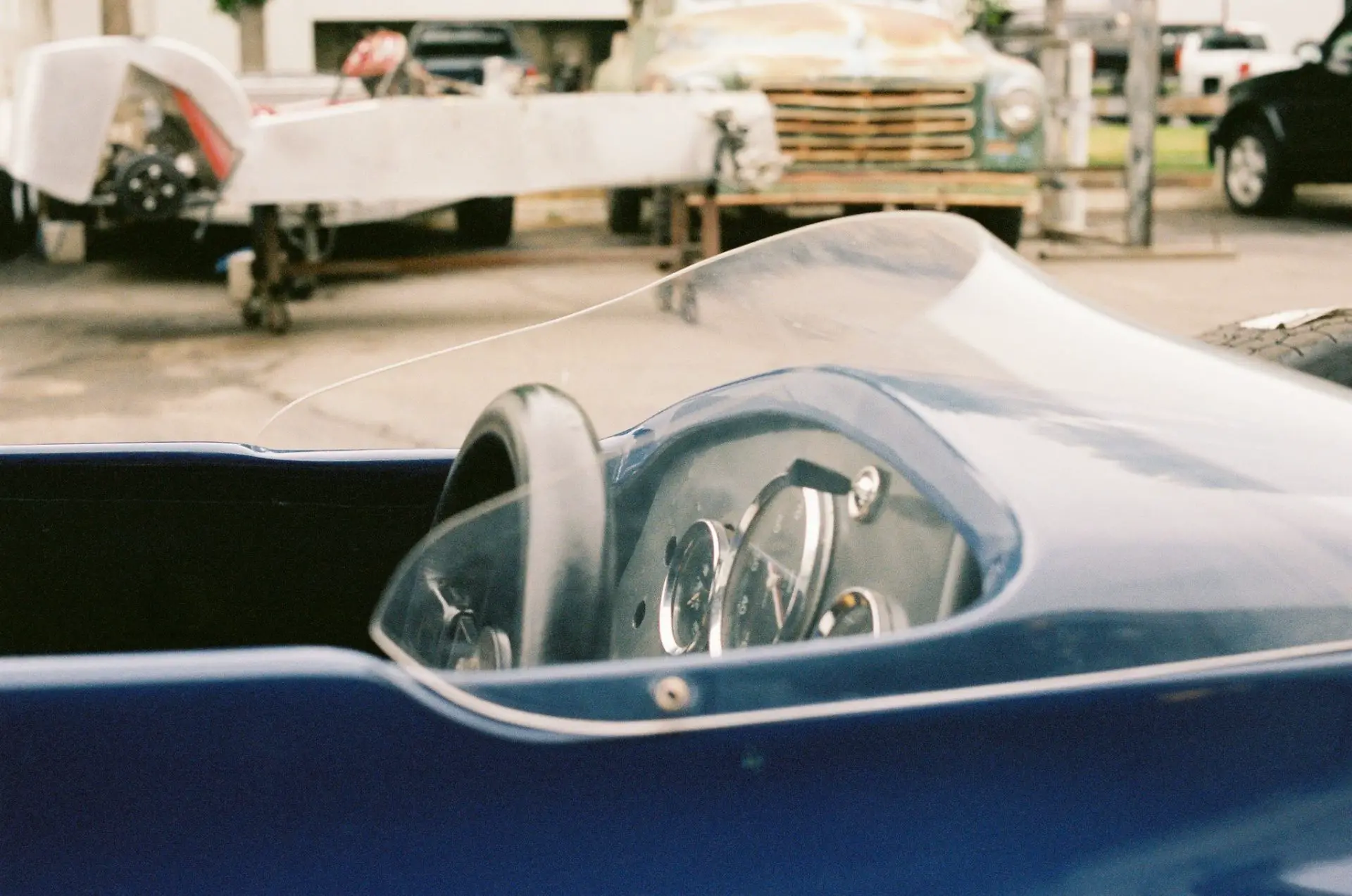 Cockpit of my Merlyn Mk11a with a Lotus Super 7 project in the background.