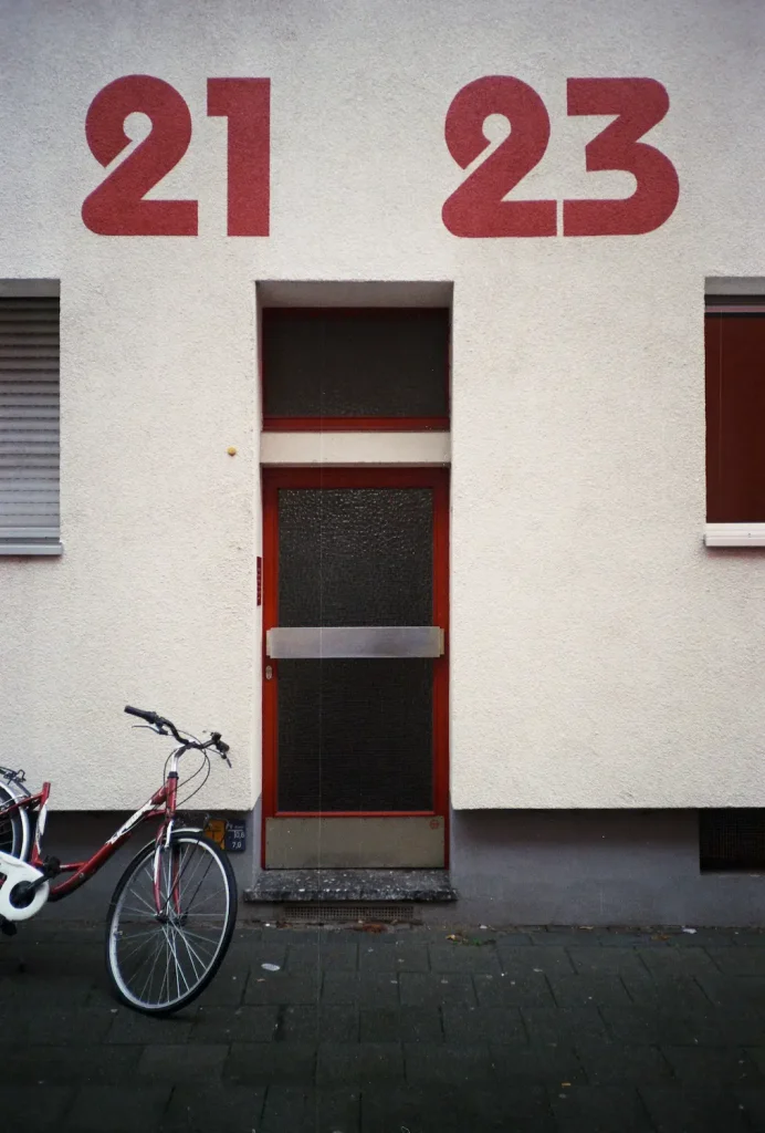 Sharp. Details are good, you can read the small signs next to the bike. (ISO 200 rebranded Fuji print film)