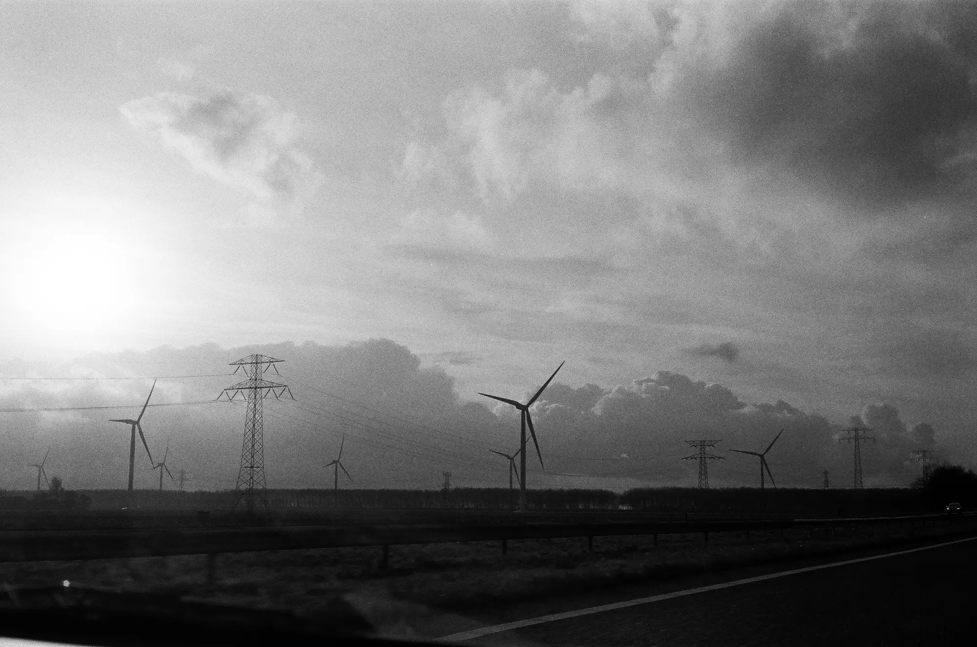 Taken from a driving car, so long exposure was out of the question. It looks underexposed to me, but the negative looks fine and I like the clouds. Btw, typical Dutch flat landscape!