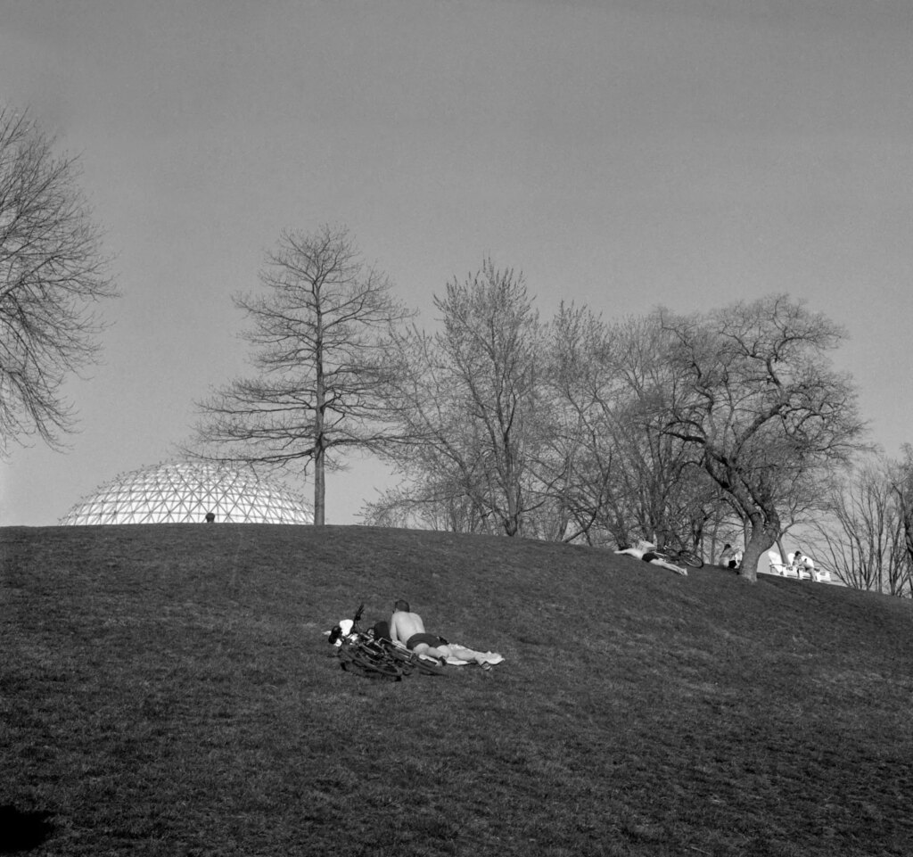 Ontario Place - Sunbathers on Hill with Cineshpere in Background