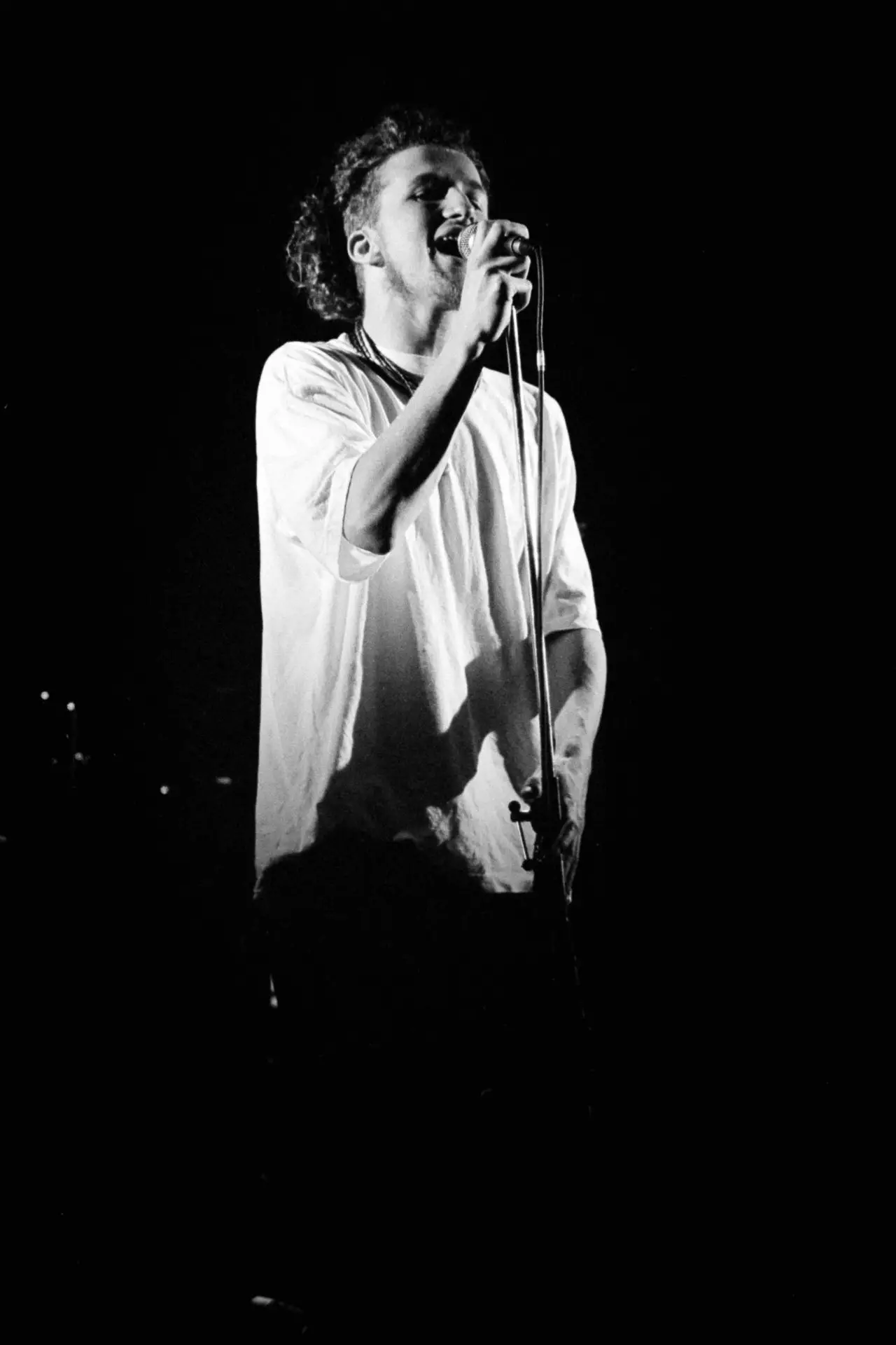 black and white image of a man singing