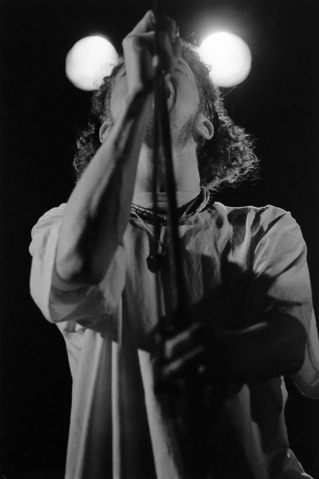 black and white image of a man singing