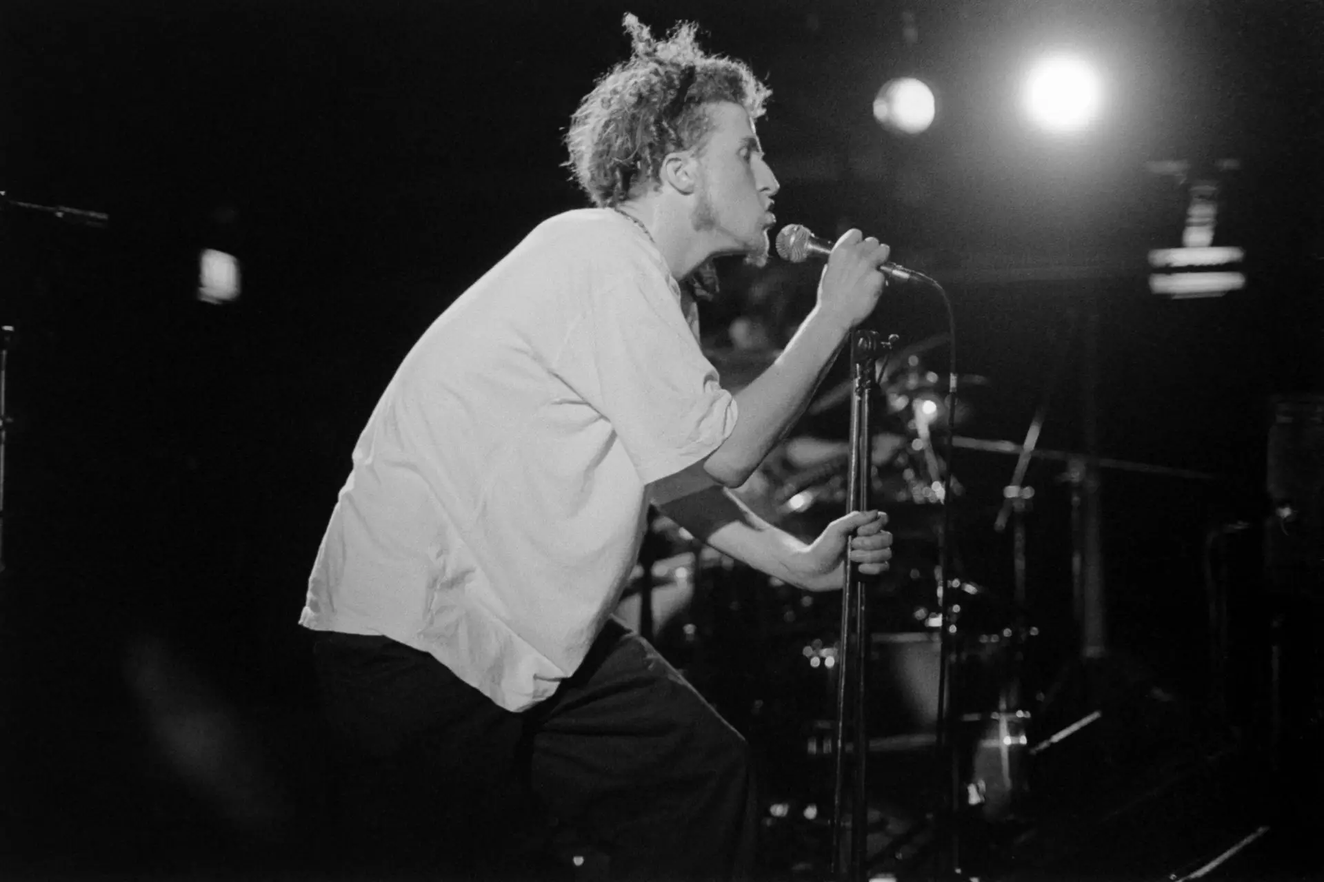 black and white image of a man singing