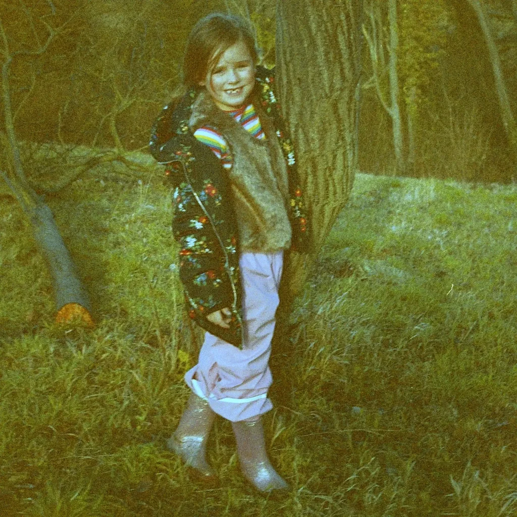 child posing for photograph