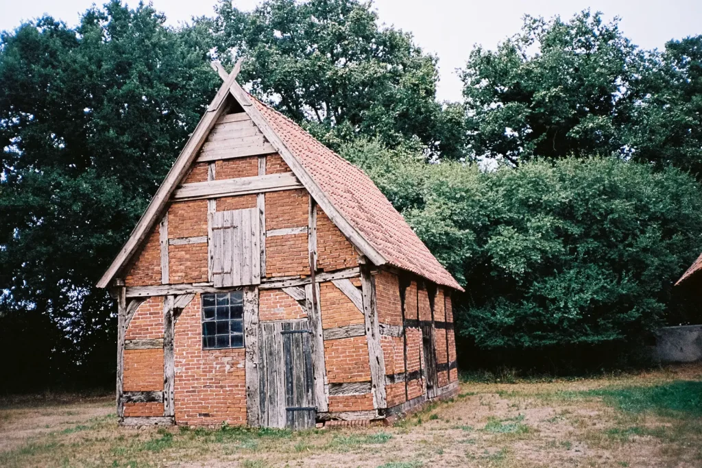 A small barn-like building made of bricks and wood.