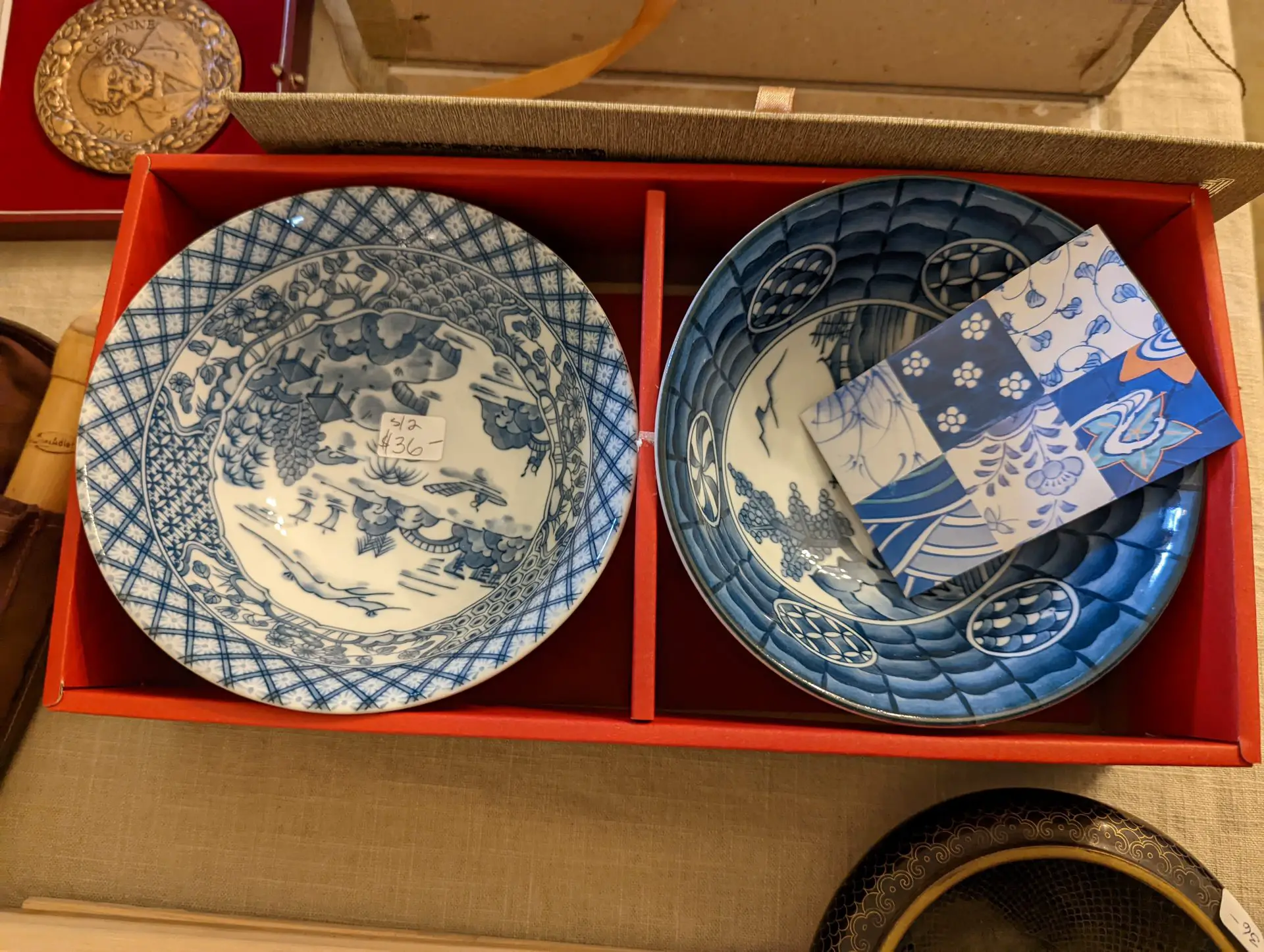 A picture of Japanese ceramic bowls in a box