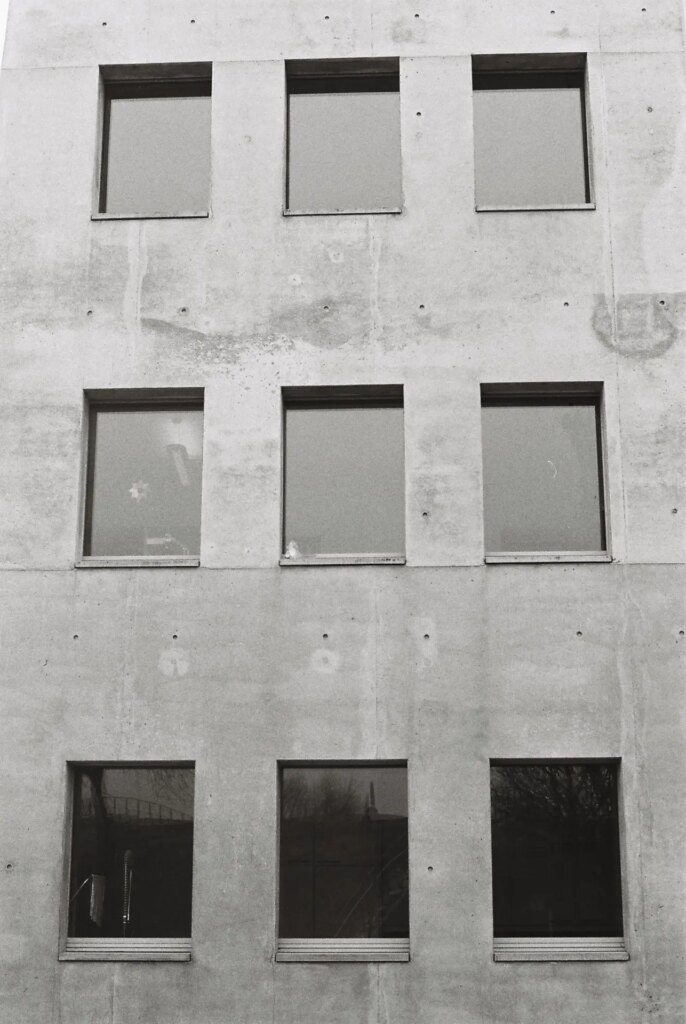 windows on the wall of a church