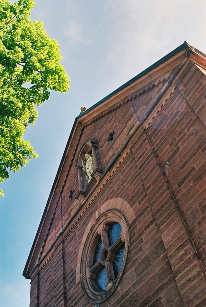 church with blue sky and tree