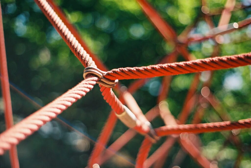 The ropes of a climbing frame in a playground