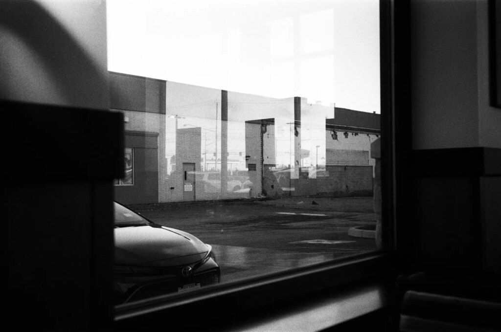 A reflection in a window of a restaurant