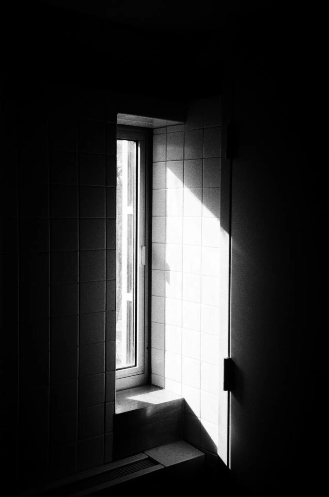A ray of light comes through an open window