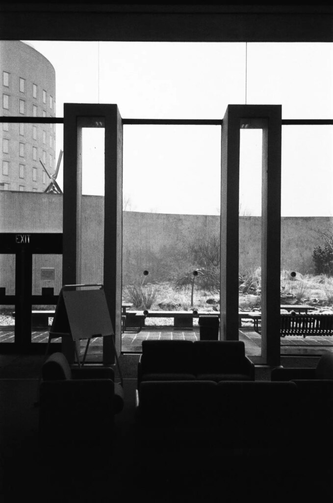 A library window with couches in front